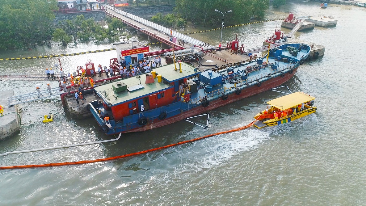 SOS team deploying response equipment and vessels on a river